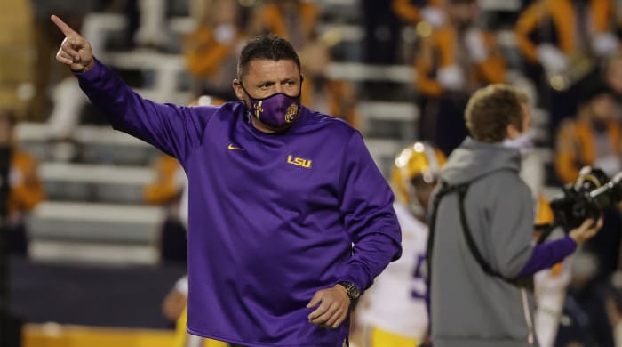 Dec 5, 2020; Baton Rouge, Louisiana, USA; LSU Tigers head coach Ed Orgeron watches warm ups prior to kickoff against the Alabama Crimson Tide at Tiger Stadium.